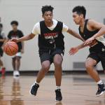Malakai Nichols, left, drives against LJ Elizarde during boys varsity basketball practice at Juneau-Douglas High School: Yadaa.at Kalé on Tuesday, Dec. 10, 2019. (Michael Penn | Juneau Empire FIle)
