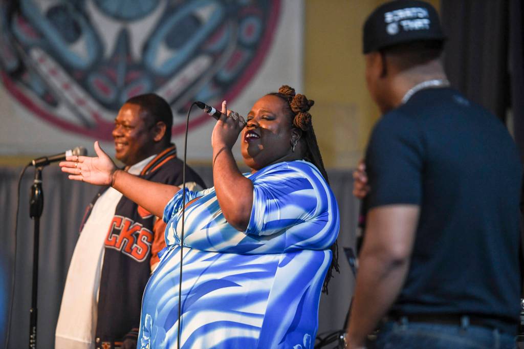 Jocelyn Miles performs with Lance Mitchell, left, and Tony Tautar-Pearce during the Killah Priest of Wu Tang Southeast Tour at the Juneau Arts & Culture Center on Friday, Dec. 20, 2019. (Michael Penn | Juneau Empire)