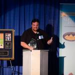 Chad Bentz speaks at the 13th annual Alaska Sports Hall of Fame Ceremony at the Anchorage Museum Atrium on Thursday, April 25, 2019. Bentz and trapshooter Corey Cogdell-Unrein headlined the 2019 Hall of Fame class. (Courtesy Photo | Jim Kohl Photography)