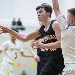 Juneau-Douglas Brock McCormick, left, passes away from Maine-Endwells Jack Coleman and Gannon Russell, right, at the Princess Cruises Capital City Classic at Juneau-Douglas High School on Saturday, Dec. 29, 2018. Juneau-Douglas won 66-61. (Michael Penn | Juneau Empire File)
