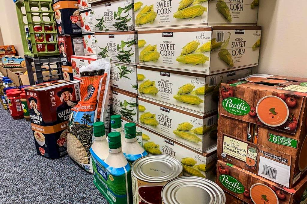 Workers at the Department of Law in Juneau donated more than $2,000 and more than 1,000 pounds of food to charities this year. (Courtesy photo | Department of Law)