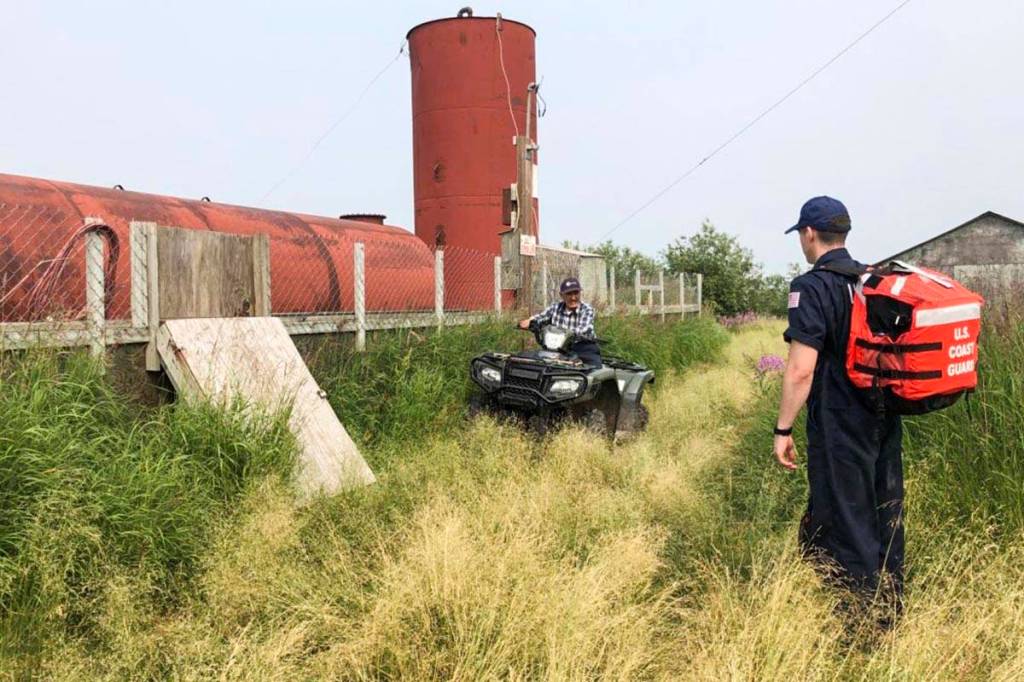 Petty Officer 3rd Class Shawn Keeman (right), an inspector on temporary duty for Coast Guard Sector Anchorage, prepares to inspect a fuel storage facility in Oscarville, Alaska, July 9, 2019. (Petty Officer 3rd Class Alyssa Zappe | U.S. Coast Guard)