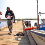 Russ Hazlett (left), a commercial fishing vessel inspector for Coast Guard Sector Anchorage, performs a CFV safety exam in Kotzebue, Alaska, July 10, 2019. (Courtesy photo | U.S. Coast Guard)