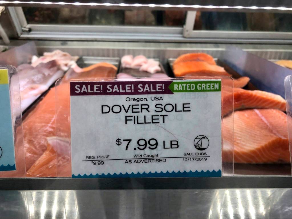 In this Dec. 17, 2019 photo, wild-caught Dover sole from Oregon waters is sold in a grocery store seafood case in Lake Oswego, Oregon. Dover sole is a species of groundfish, which as a group have been under strict catch quotas to try to save nine overfished species. (AP Photo/Gillian Flaccus)