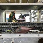 In this Dec. 11, 2019 photo, a worker sorts fish being unloaded from a bottom trawler containing rockfish and other groundfish species in Warrenton, Oregon. (AP Photo/Gillian Flaccus)