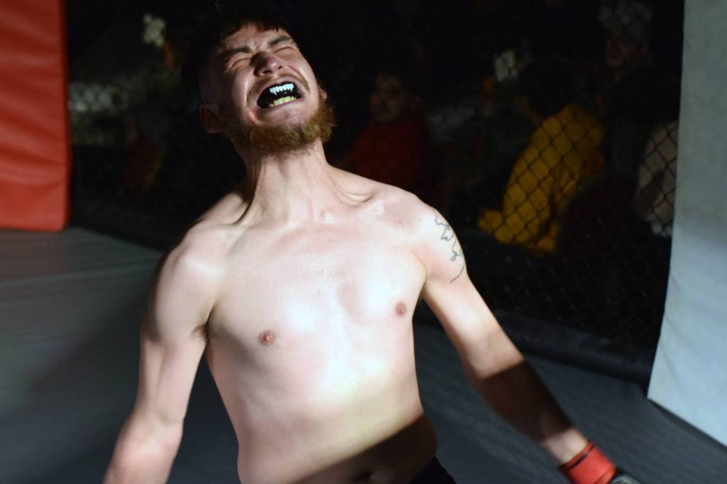 Daniel Tweedy celebrates his victory over Erick Whisenant in an MMA bout at AK Beatdown 35 at Elizabeth Peratrovich Hall on Friday, Dec. 27, 2019. (Nolin Ainsworth | Juneau Empire)