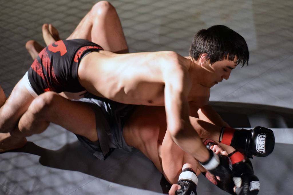Jaiden Kohler throws punches at Joe Alley in an MMA bout at AK Beatdown 35 at Elizabeth Peratrovich Hall on Friday, Dec. 27, 2019. (Nolin Ainsworth | Juneau Empire)