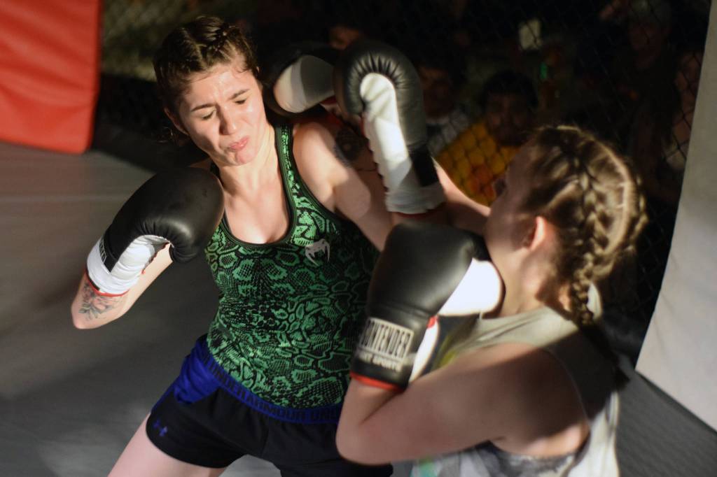 Amanda Empson dodges Nicole Funks punch in their boxing bout at AK Beatdown 35 at Elizabeth Peratrovich Hall on Friday, Dec. 27, 2019. (Nolin Ainsworth | Juneau Empire)