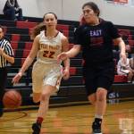 West Valley High Schools Ali May drives against East Anchorages Kristi Anderson in the second half of their game at the Princess Cruises Capital City Classic at JDHS on Monday, Dec. 20, 2019. (Nolin Ainsworth | Juneau Empire)