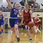 Juneau-Douglas High School: Yadaat.at Kales Kendyl Carson gets around Sitkas Chloe Morrison in the fourth quarter of a game in the Princess Cruises Capital City Classic at JDHS on Monday, Dec. 30, 2019. (Nolin Ainsworth | Juneau Empire)