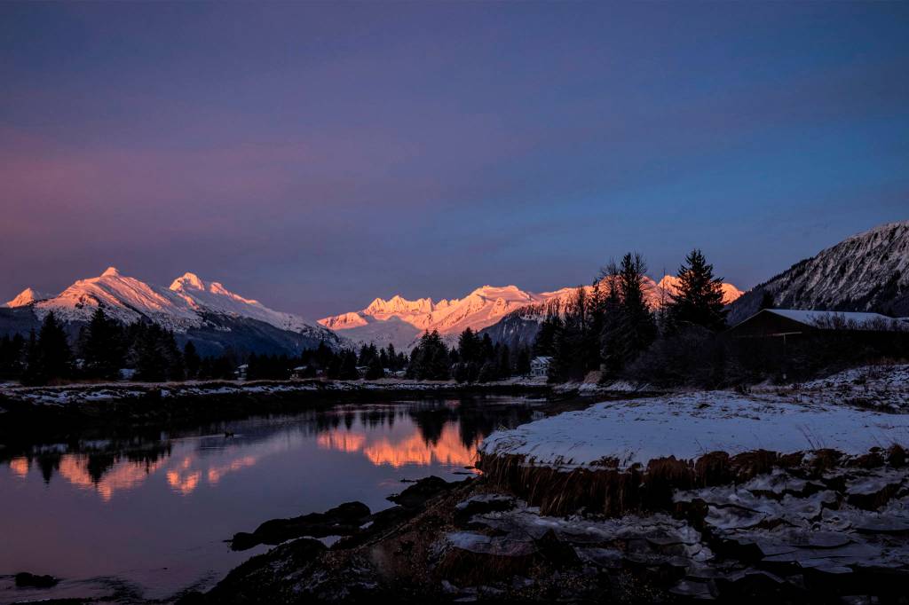 Courtesy Photo | Janice Gorle                                Alpenglow-illuminated mountains reflect off the Mendenhall River on Sunday.