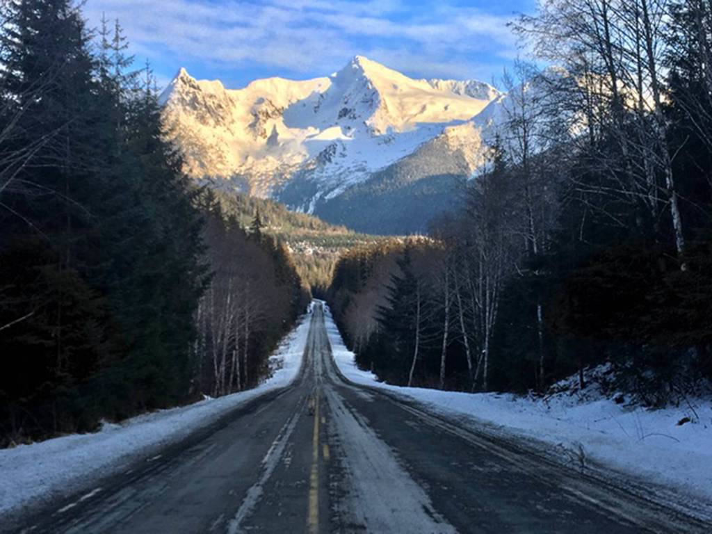 Snow-capped mountains loom near the end of the road in this photograph taken Friday, Jan. 17, 2020. (Courtesy photo | Denise Carroll)