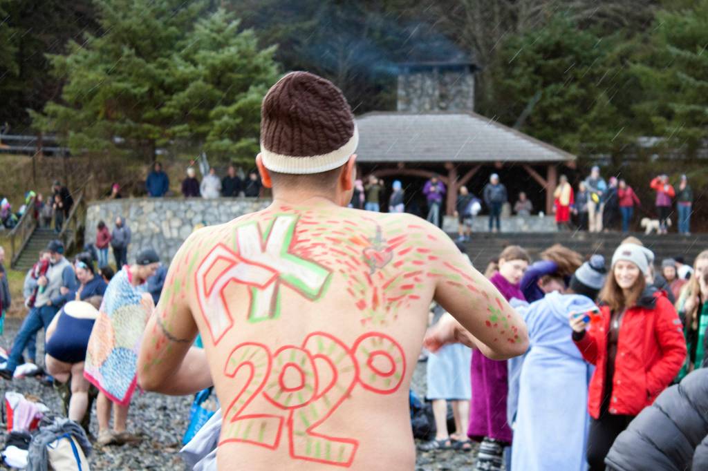 Marvin Peña sports back art Wednesday, Jan. 1, at the 2020 Polar Bear Dip. (Ben Hohenstatt | Juneau Empire)