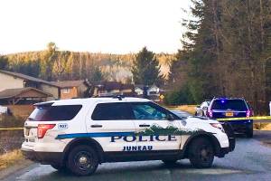 Officer from the Juneau Police Department investigate an officer involved shooting that occured early Sunday morning off of Cinema Drive, Dec. 29, 2019. (Michael S. Lockett | Juneau Empire)