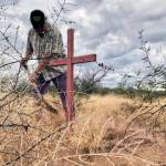 Cheryl Bowman | Courtesy Photo                                Alvaro Enciso plants homemade crosses to mark where immigrants were found dead in the Arizona desert.