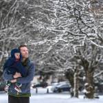 David Phillips views the fresh snow at Evergreen Cemetery while walking with his son, Russell, 1, on Monday, Jan. 6, 2020. (Michael Penn | Juneau Empire)