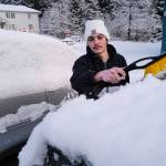 Tommy Reber cleans a fresh coat of snow off his vehicle at Gruening Park on Monday, Jan. 6, 2020. (Michael Penn | Juneau Empire)