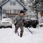 Matt Brooks clears snow out of his driveway along Douglas Highway on Tuesday, Jan. 7, 2020. (Michael Penn | Juneau Empire)
