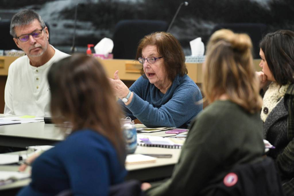 Paula Terrel asks a question of Capt. Steve White, from U.S. Coast Guard Sector Juneau, during his presentation to the Visitor Industry Task Force in the Assembly chambers on Tuesday, Jan. 7, 2020. (Michael Penn | Juneau Empire)