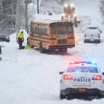 A First Student school bus stalls out at D and 4th Streets in Douglas after snowfall on Tuesday, Jan. 7, 2020. No students were on the bus at the time and the bus was safely backed down the street. (Michael Penn | Juneau Empire)