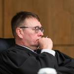 Superior Court Judge Eric Aarseth listens to arguments over an effort to recall Gov. Mike Dunleavy Friday in Anchorage. (Loren Holmes | Anchorage Daily News via AP)