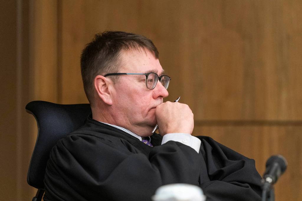 Superior Court Judge Eric Aarseth listens to arguments over an effort to recall Gov. Mike Dunleavy Friday in Anchorage. (Loren Holmes | Anchorage Daily News via AP)