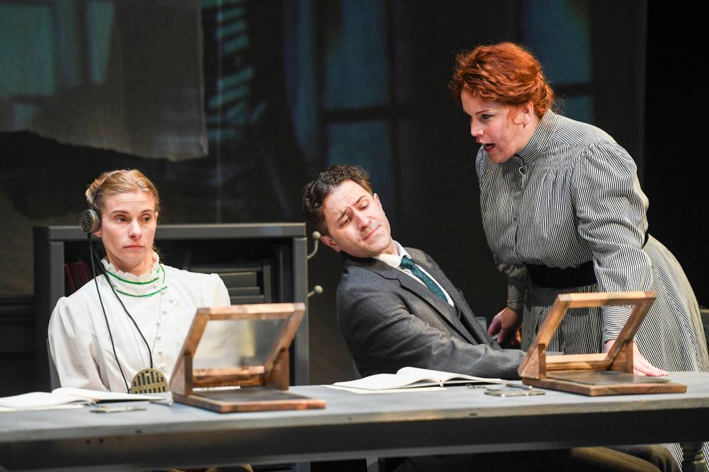 Shelley Virginia, left, Ty Hewitt, center, and Margeaux Ljungberg rehearse in front of an invited audience for Perseverance Theatres production of Silent Sky on Tuesday. (Michael Penn | Capital City Weekly)