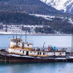 photos by Michael S. Lockett | Juneau Empire                                The derelict tugboat Lumberman lies moored to a city-owned pier on Sunday after coming adrift and grounding near Norway Point downtown.