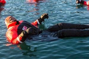 Petty Officer 2nd Class Steven Knight waits for their fifteen minute swim to be up during cold water survival training at Coast Guard Station Juneau, Jan. 13, 2020. (Michael S. Lockett | Juneau Empire)
