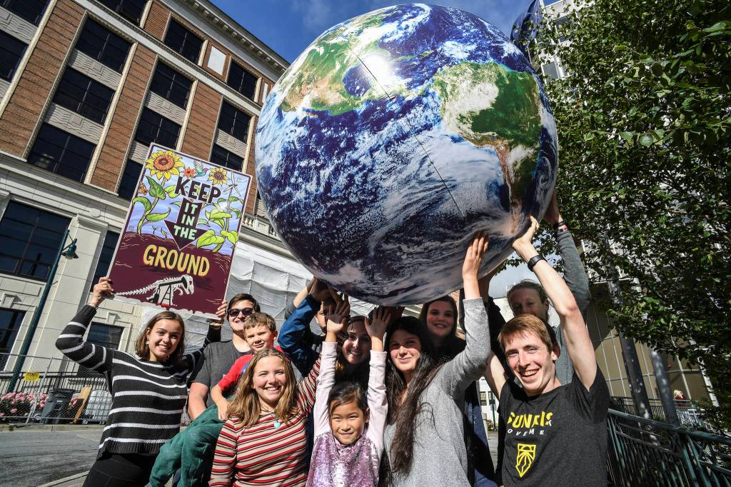 Michael Penn | Juneau Empire File                                Students associated with 350 Juneau, a local chapter of an international grassroots climate movement, meet in September 2019, in front of the Alaska State Capitol. The organization will hold a climate rally when the Legislature is back in session Tuesday.