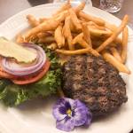 Bubble Rooms butchers grind burger, Jan. 7, 2020. (Peter Segall | Juneau Empire)