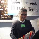 Iola Young, organizing committee member for 100 Women Who Care Juneau; and Jane Lindsey, organizing committee member for 100 Women Who Care Juneau, helps sign in a woman ahead of a meeting at the Hangar Ballroom, Thursday, Jan. 16, 2020. (Ben Hohenstatt | Juneau Empire)