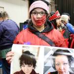 Cassandra Cropley holds a poster showing photos of her cousin, Linda Skeek, after the 2020 Womens March, Jan. 18. Skeek went missing in January 2016 and is feared dead. (Ben Hohenstatt | Juneau Empire)