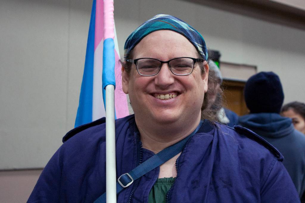 Emily Mesch smiles after participating in the 2020 Womens March, Saturday, Jan. 18. The march started at the capitol, but it quickly made its way to Centennial Hall. (Ben Hohenstatt | Juneau Empire)