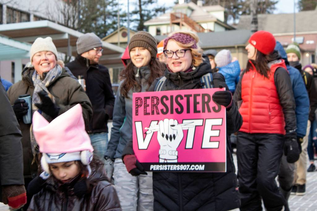 Marchers make their way down Main Street during the Womens March, Saturday, Jan. 18, 2020. (Ben Hohenstatt | Juneau Empire)
