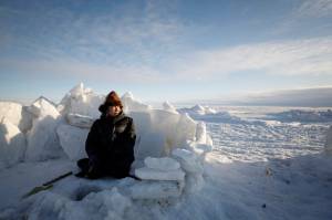 Mary Kailukiak fishes for tomcod and smoalt on the Bering Sea Saturday, Jan. 18 near Toksook Bay. The first Americans to be counted in the 2020 Census starting today live in this Bering Sea coastal village. The Census traditionally begins earlier in Alaska than the rest of the nation because frozen ground allows easier access for Census workers, and rural Alaska will scatter with the spring thaw to traditional hunting and fishing grounds. (AP Photo | Gregory Bull)