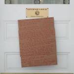 The sign nailed to the Governors Mansion by a man on Jan. 20, 2020. (Courtesy Photo)