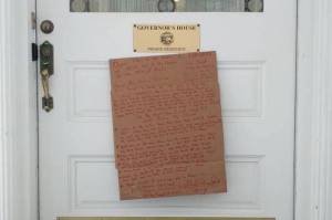 The sign nailed to the Governors Mansion by a man on Jan. 20, 2020. (Courtesy Photo)