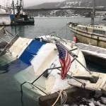 A submerged boat at Harris Harbor activated an automatic emergency beacon, triggering a search and rescue deployment from local Coast Guard units on Jan. 23, 2020. (Michael S. Lockett | Juneau Empire)