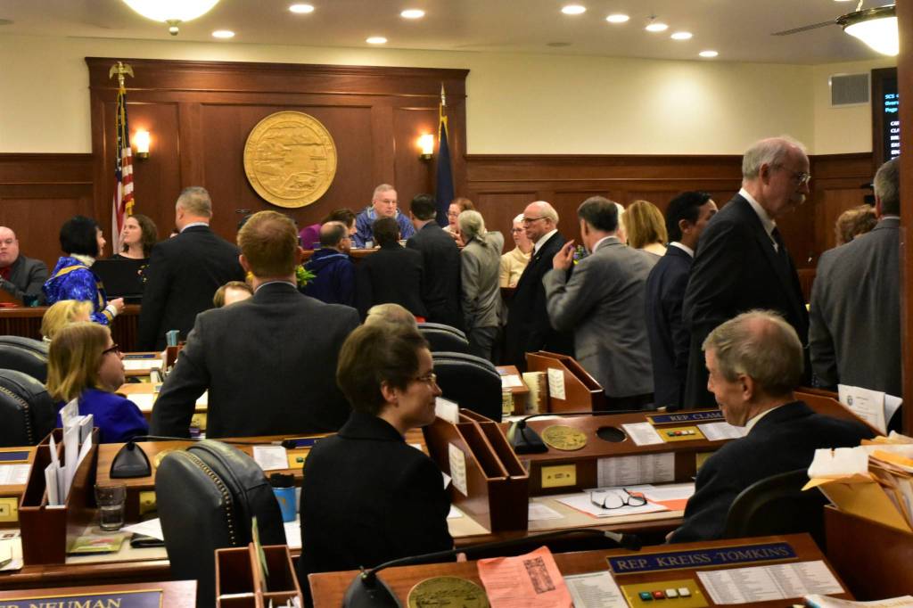 Representatives and senators talk during an at ease during a joint session on Friday, Jan. 24, 2020. (Peter Segall | Juneau Empire)