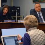 Sen. Cathy Giessel, R-Anchorage, and Sen. Mike Shower, R-Wasilla, listen Margie Beedle give testimony Monday. (Ben Hohenstatt | Juneau Empire)