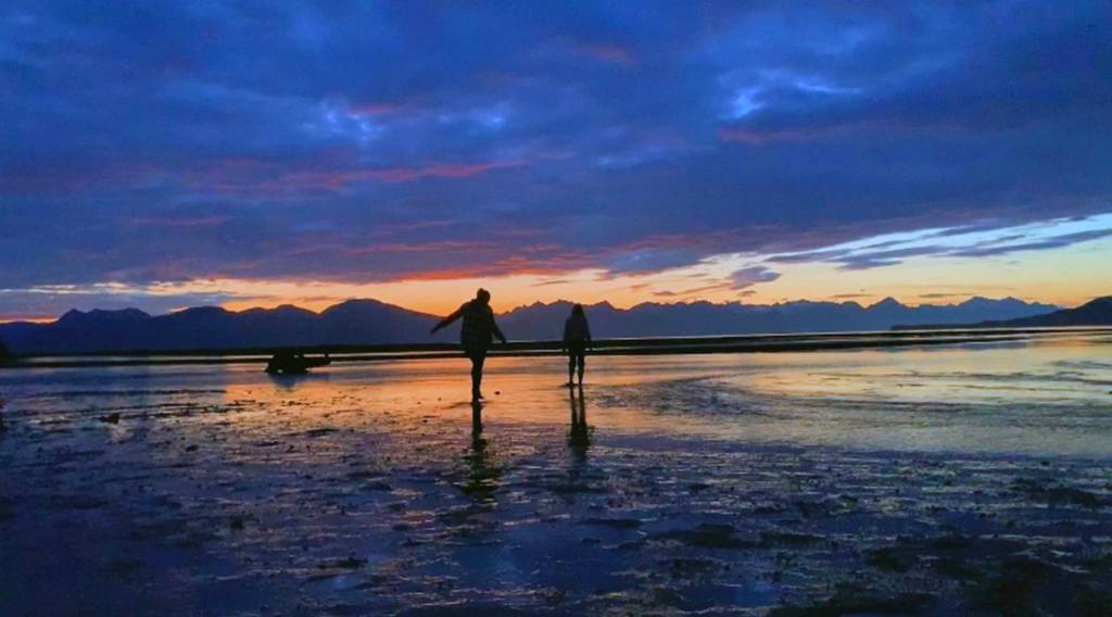 Beachgoers are silhouetted at Echo Ranch in Berners Bay, September 2019.                                Courtesy photo | Lera Jimmerson