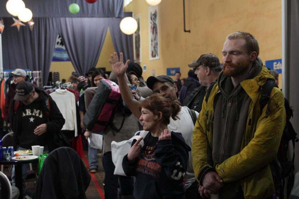 Guests stand in line for a hot lunch at the Juneau Coalition for Housing and Homelessness 9th annual Homeless Connect event at the Juneau Arts and Culture Center Wednesday. (Michael S. Lockett | Juneau Empire)