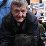 Cary Shilts, a guest, poses with his dog at the Juneau Coalition for Housing and Homelessness 9th annual Homeless Connect event at the Juneau Arts and Culture Center, Jan. 29, 2020. (Michael S. Lockett | Juneau Empire)