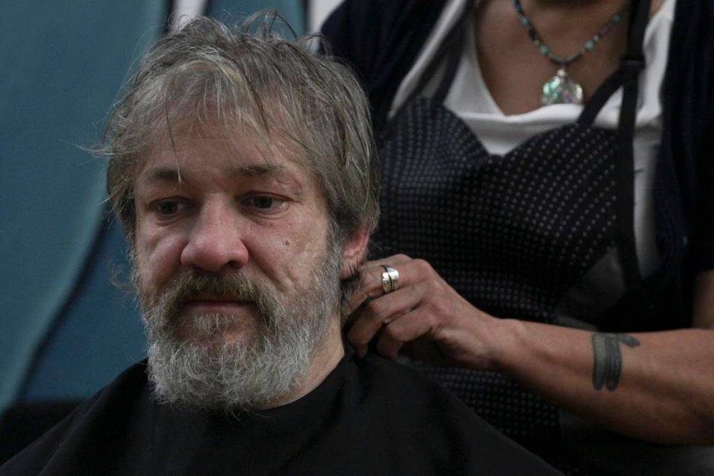 Steven Lythgoe gets his hair cut by Jamiann Hasselquist at the Zach Gordon Youth Center during the Juneau Coalition for Housing and Homelessness 9th annual Homeless Connect event, Jan. 29, 2020. (Michael S. Lockett | Juneau Empire)