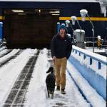 Keegan Krantz, 30, and his dog Nootka on the loading ramp to the FMV Matanuska on Thursday. (Peter Segall | Juneau Empire)