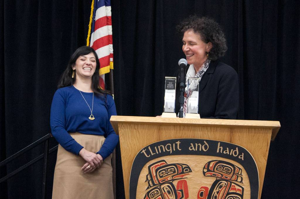 Foundroot co-owner Leah Wagner and Spruce Root Boardmember Susan Bell share a laugh after Bell told Wagner that Wagners company makes magic happen at Bells dinner table during the presentation of the Path to Prosperity awards Wednesday, Feb. 5, 2020. (Ben Hohenstatt | Juneau Empire)