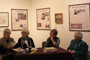 From right to left, Karleen Grummett, Marjorie Alstead Shakelford, Mary Tanaka Abo and Marie Darlin discuss the Empty Chair exhibit at the Juneau-Douglas City Museum on Saturday, Oct. 11, 2014. The exhibit will be at the museum through the end of the month. (Stephanie Shor | Juneau Empire)