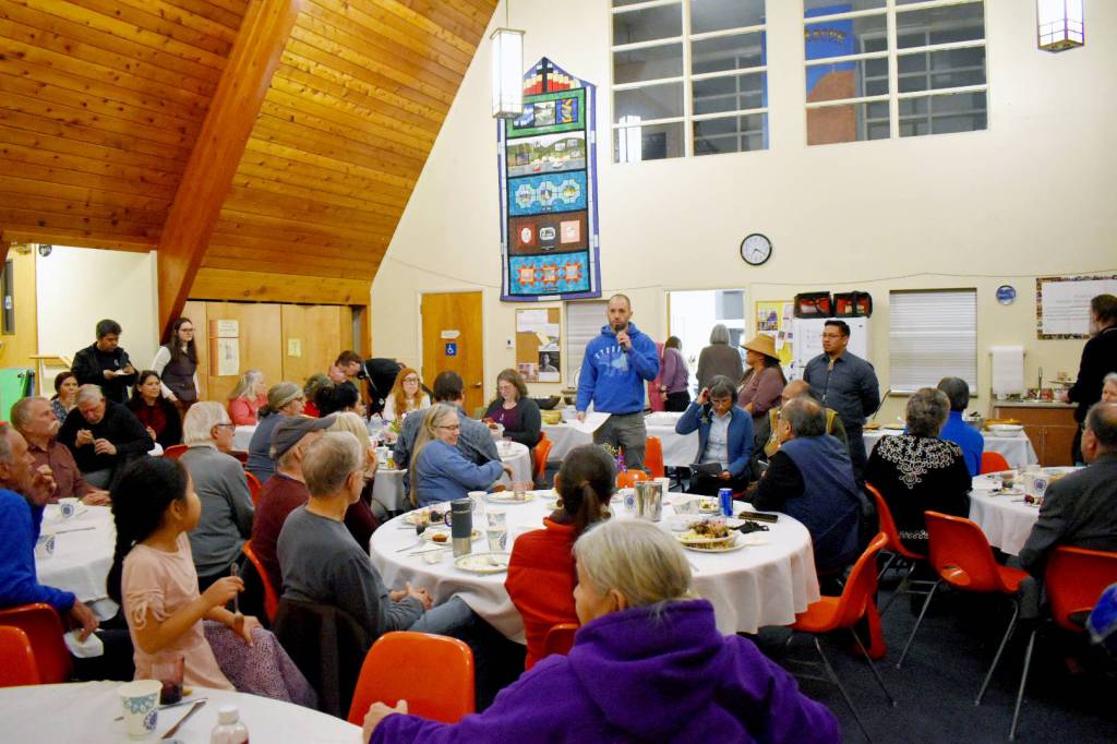 Mollie Barnes | For the Capital City Weekly                                Ryan Conarro, Juneau artist, member of New York-based Ping + Chong Company and co-artistic collaborator and facilitator for the Juneau Voices Audio Wayfinding Project, speaks about the sign project at Northern Light United Church on Monday.
