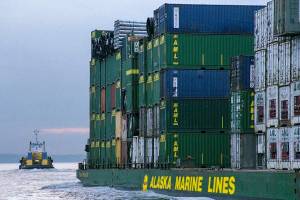 AML barge loaded with containers being towed to Alaska. (Courtesy photo | Alaska Marine Lines)